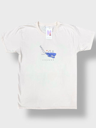 An off-white short-sleeve t-shirt with a blue line-art graphic of a person skateboarding on a skateboard, displayed flat against a light gray background.