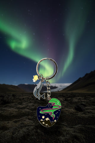 Keychain with heart-shaped charm and anchor on a white background