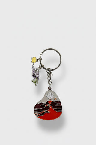 Keychain with mountain design and lavender charm on a white background