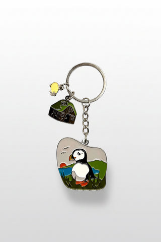 Keychain with puffin design and 'Milk and Hart' branding on a white background