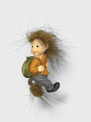 Funny Icelandic baby elf fridge magnet with messy fluffy hair, tiny backpack, and playful Nordic folklore-inspired design