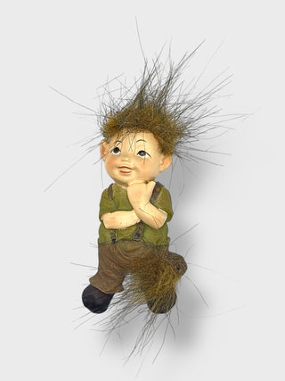 Handpainted Icelandic baby elf fridge magnet with fluffy wild hair, playful smile, and Nordic folklore-inspired design