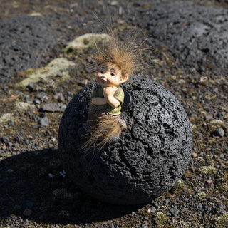 Handpainted Icelandic baby elf fridge magnet with fluffy wild hair, playful smile, and Nordic folklore-inspired design