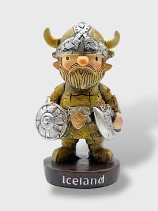 Cute Icelandic Viking warrior figurine holding an axe and shield with horned helmet and rustic Nordic design