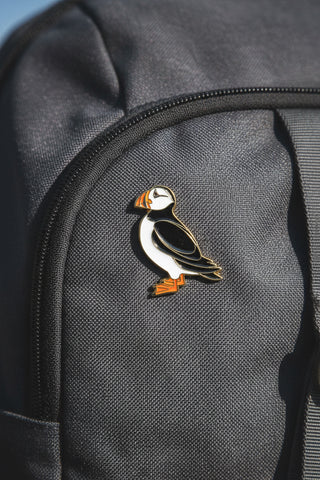 A puffin enamel pin