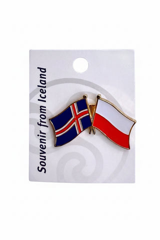 A souvenir lapel pin depicting the flags of Iceland and Poland, attached to a white display card with the text 'Souvenir from Iceland' 