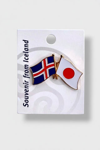 Crossed Iceland and Japan flag enamel lapel pin souvenir on white display card