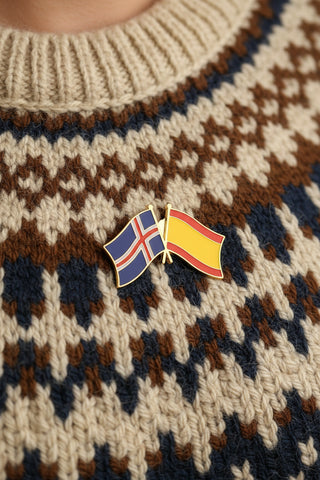 A souvenir enamel pin depicting the flags of Iceland and Spain