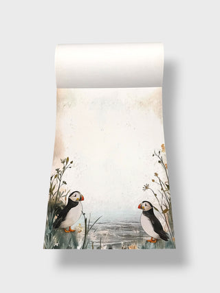 Roll of paper with puffins and nature design on a white background