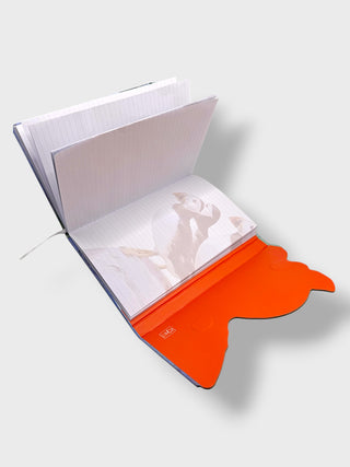 Open notebook with orange interior cover on a white background