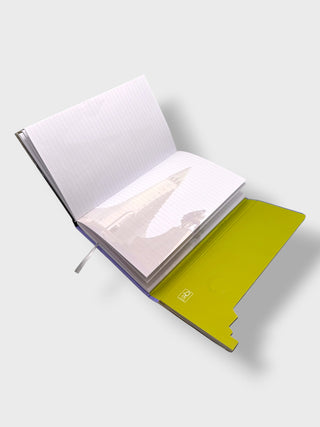 Open notebook with a yellow interior page on a light gray background