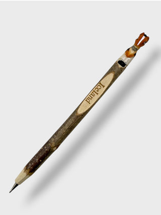 Wooden pencil with a decorative design on a white background