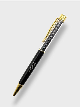Black pen with gold accents on a white background