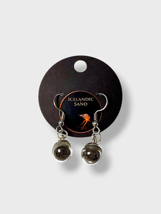 Pair of earrings on a 'Icelandic Sand' branded card against a white background