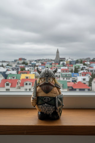 Hand-painted polyresin Icelandic Viking figurine holding a sword and shield, wearing a silver horned helmet, detailed armor, and green tunic, 14 cm (5.51 in) tall.