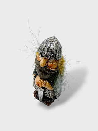 Hand-painted polyresin Icelandic Viking figurine with a silver helmet, long beard, detailed armor, and both hands resting on a large sword, 8 cm (3.15 in) tall.