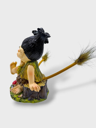 Hand-painted polyresin Icelandic troll couple sitting together with smiling faces, flowers, and playful tails, inspired by Icelandic folklore, 12 cm (4.72 in) tall.
