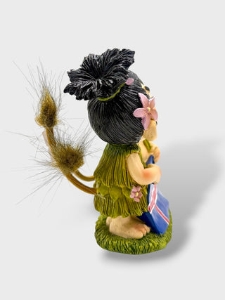 Hand-painted polyresin Icelandic troll couple kissing while holding the Icelandic flag, wearing traditional-style outfits, 12 cm (4.72 in) tall.
