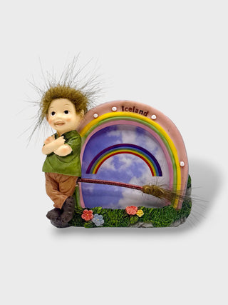 
Hand-painted polyresin Icelandic elf rainbow photo frame featuring a smiling elf, colorful rainbow, flowers, and fluffy hair, measuring 12 × 3 × 10 cm (4.72 × 1.18 × 3.94 in).
