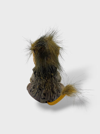 Hand-painted polyresin meditating Icelandic troll figurine sitting cross-legged with folded hands, closed eyes, fluffy hair, and a peaceful smile, 11 cm (4.33 in) tall.
