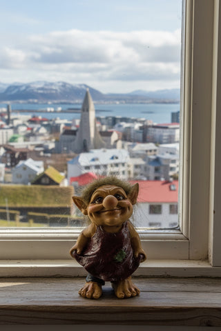 A small gnome figurine with brown skin, large pointed ears, wild brown hair, and a purple apron, standing against a light gray background.