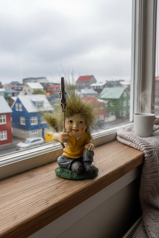 Hand-painted polyresin Icelandic elf memo clip holder wearing a yellow shirt with a metal photo clip, inspired by Icelandic Huldufólk folklore, 6 cm (2.36 in) tall.