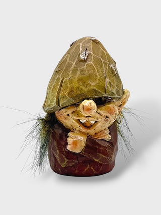Hand-painted polyresin Icelandic elf figurine with a green pointed hat, brown clothing, smiling face, and detailed features, inspired by Icelandic Huldufólk folklore, 8 cm (3.15 in) tall
