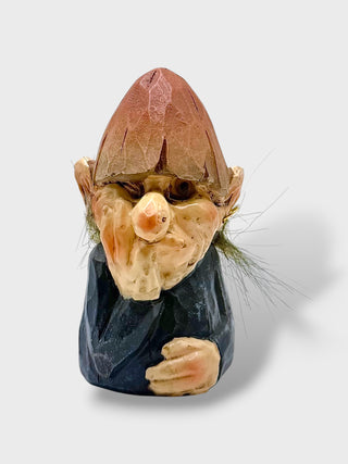Hand-painted polyresin Icelandic elf figurine with a pointed brown hat, dark blue coat, and detailed facial features, inspired by Icelandic Huldufólk folklore.
