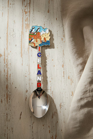 Iceland souvenir spoon with puffins on colorful sea cliffs, ocean scenery and Iceland lettering