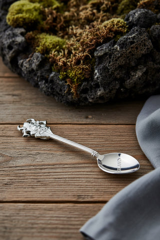 Silver-tone Iceland souvenir spoon with ornate Viking design, crossed axes, horned helmet and Iceland engraving