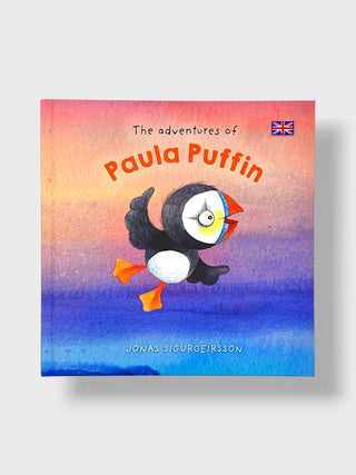 The Adventures of Paula Puffin children's book cover, featuring a watercolor-style illustration of a puffin against a pink, orange, and blue gradient sky. The title is written in orange text, and the author's name, Jonas Sigurgeirsson, is visible at the bottom.