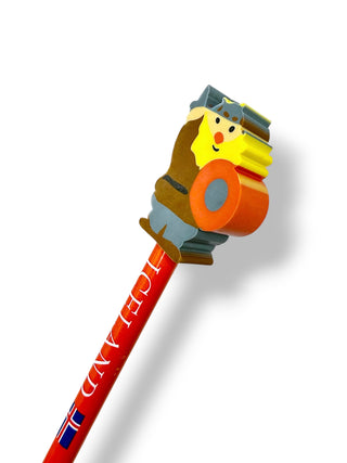 A novelty pencil with a red body printed with 'ICELAND' and a small flag, topped with a colorful cartoon figure holding an orange object, shown on a white background.