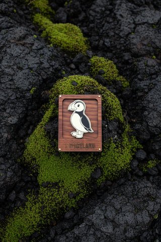 Glow-in-the-dark Iceland puffin magnet with wooden frame, black and white puffin design and I Love Iceland lettering