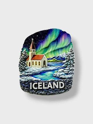Iceland ceramic magnet featuring Northern Lights, snowy church, mountains, winter landscape and Iceland lettering