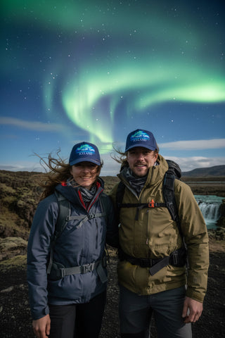 Blue Iceland cap with Northern Lights, snowy mountain design and white Iceland lettering on the front