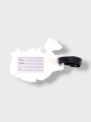 A white luggage tag shaped like a map outline with a black strap, shown on a light gray background.
